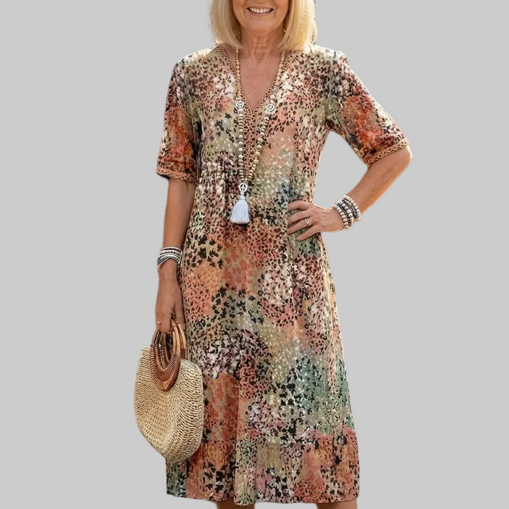 Damen Midi-Kleid mit Muster. Lockeres & bequemes Freizeitkleid mit V-Ausschnitt und Kurzarm.