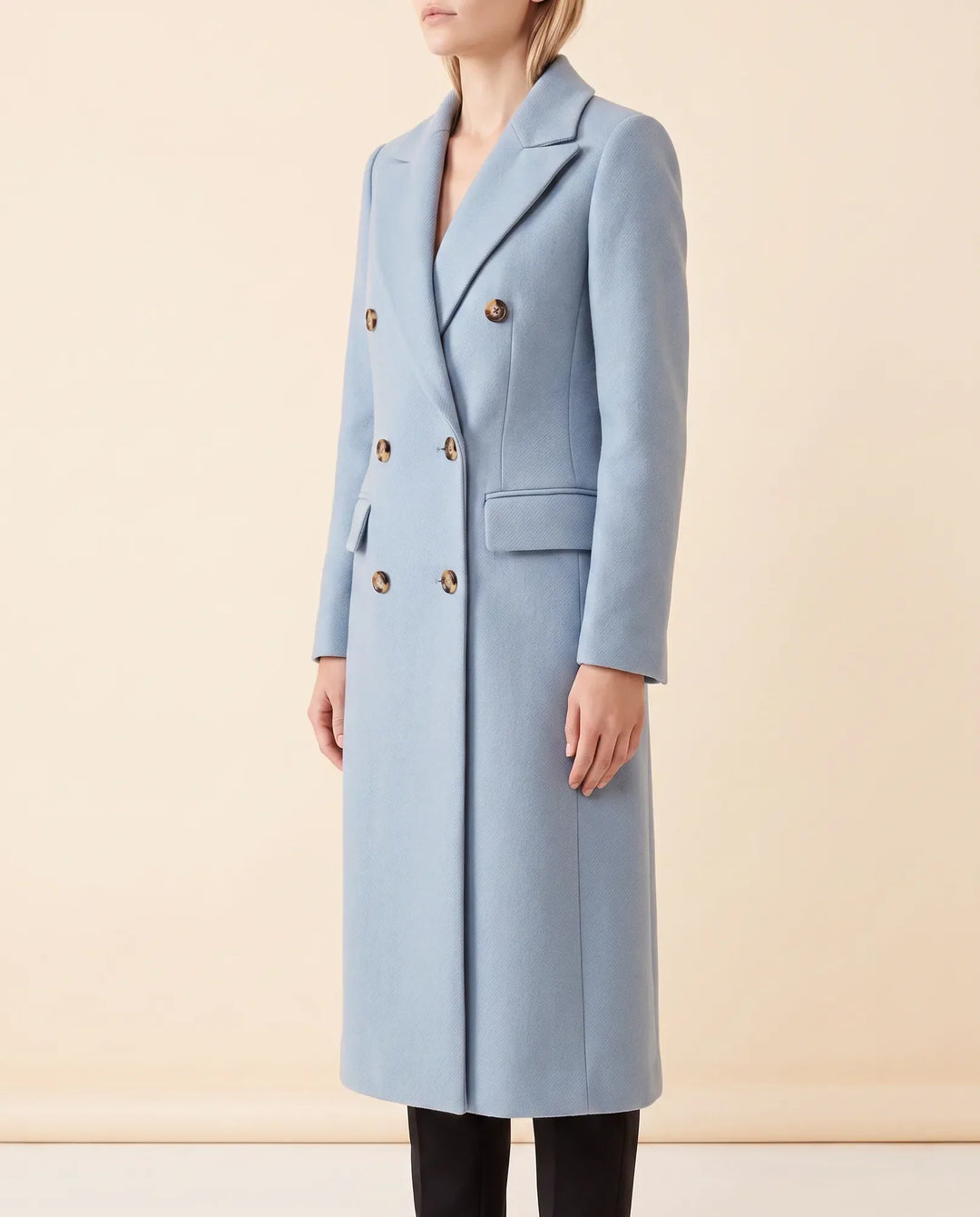 Eleganter Damen-Zweireiher-Mantel, lang. Tailliert für eine schmeichelhafte Silhouette.