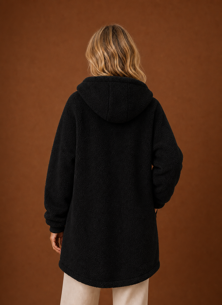 Elegante Damen Oberbekleidung: lange Kapuzenjacke, warm & bequem, für jede Freizeit.