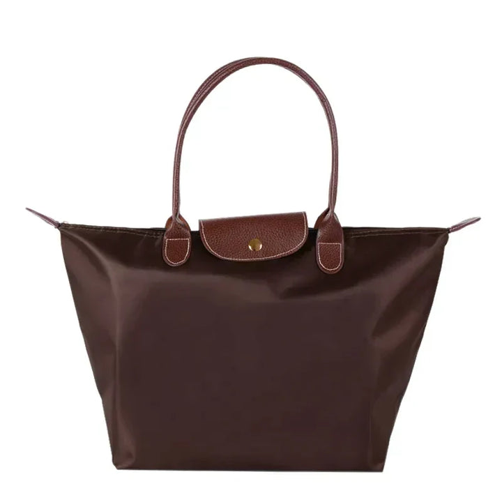 Vielseitige Damen Handtasche Celeste in Grün. Trageschlaufe & Reißverschluss sichtbar.