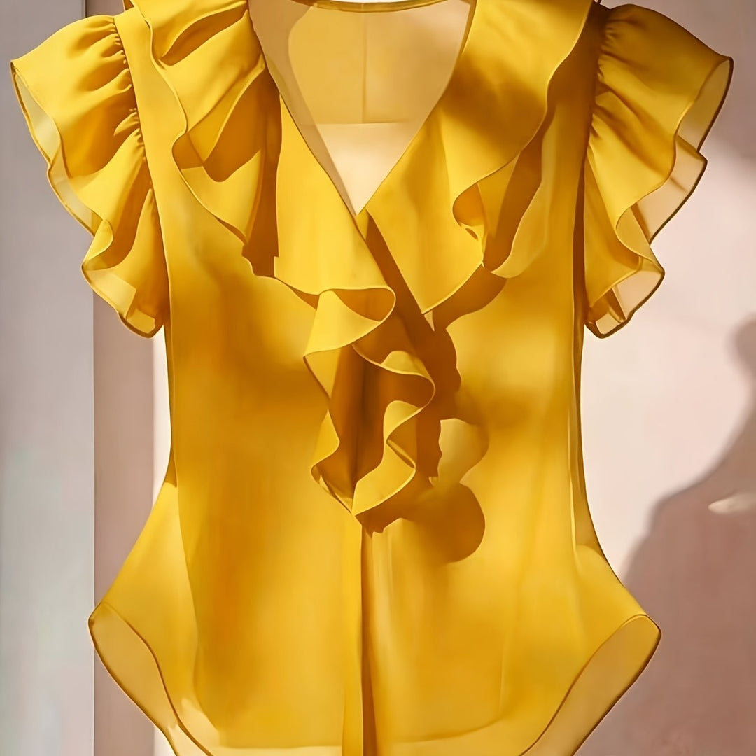 Damenmode: Elegante Rüschenbluse mit Volantärmeln. Ein echter Blickfang.