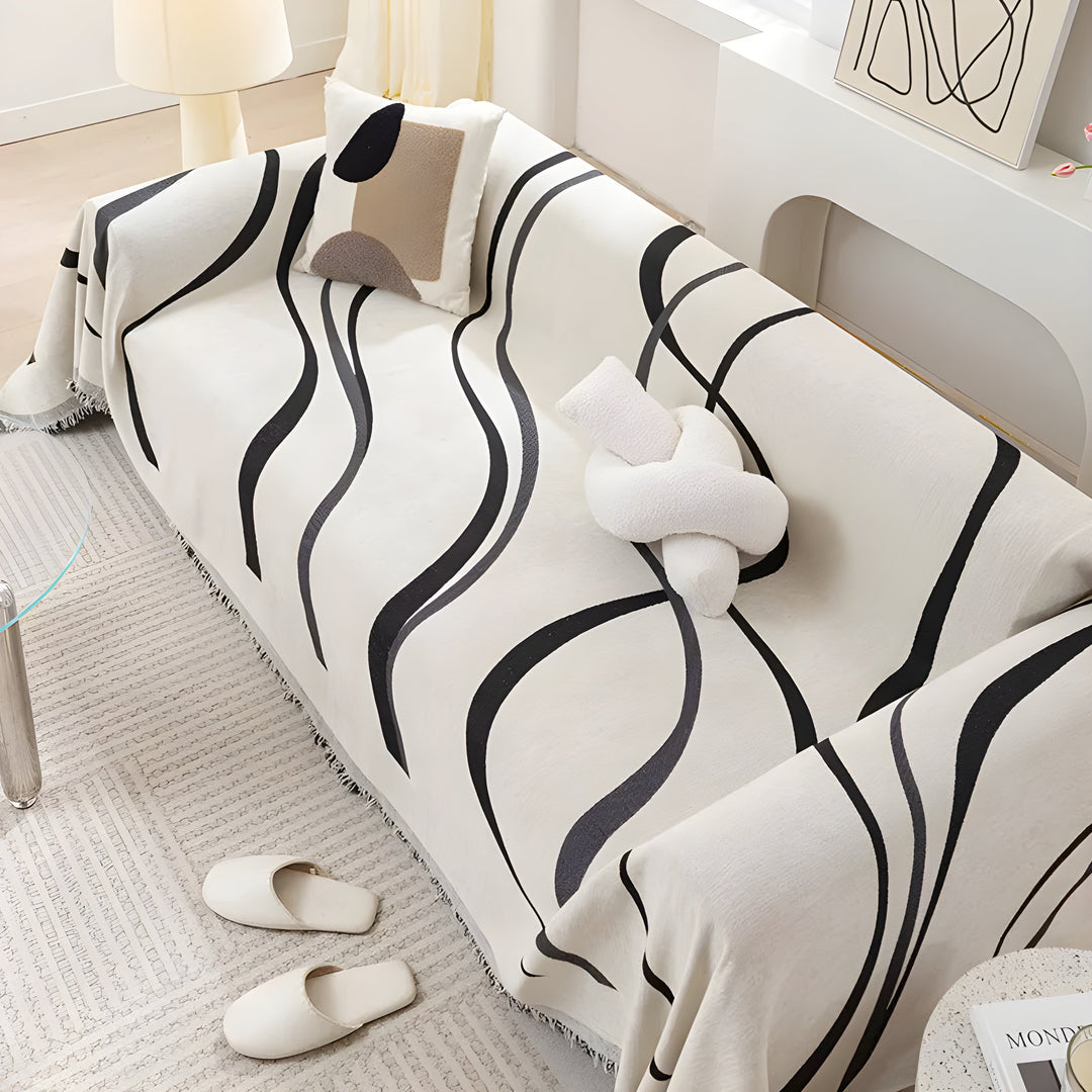 Robuster umkehrbarer Sofaschutz aus Chenille in elegantem Grau. Eine Seite grau, die andere khaki.