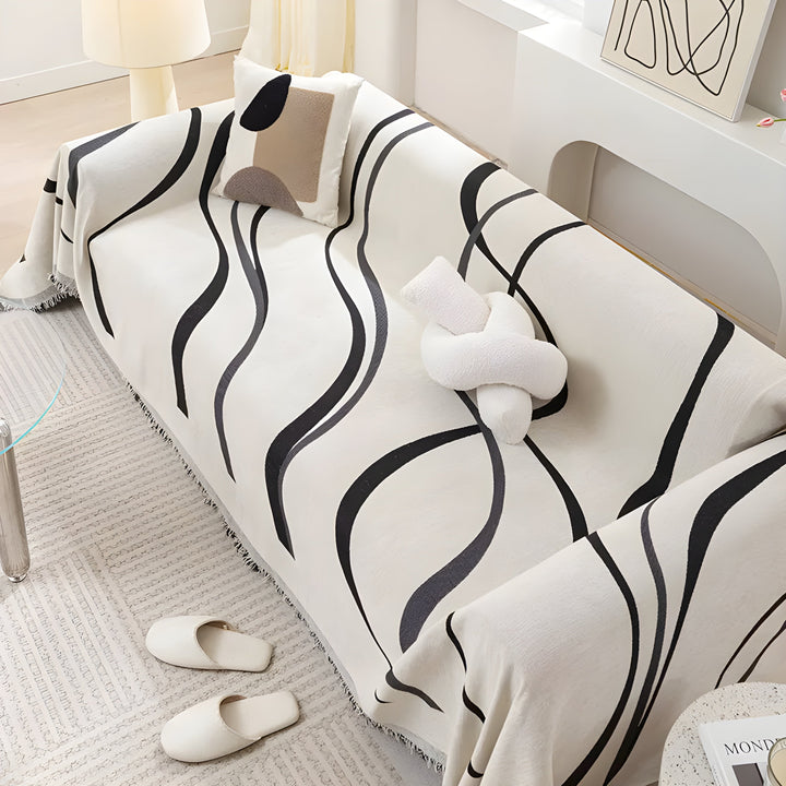 Robuster umkehrbarer Sofaschutz aus Chenille in elegantem Grau. Eine Seite grau, die andere khaki.