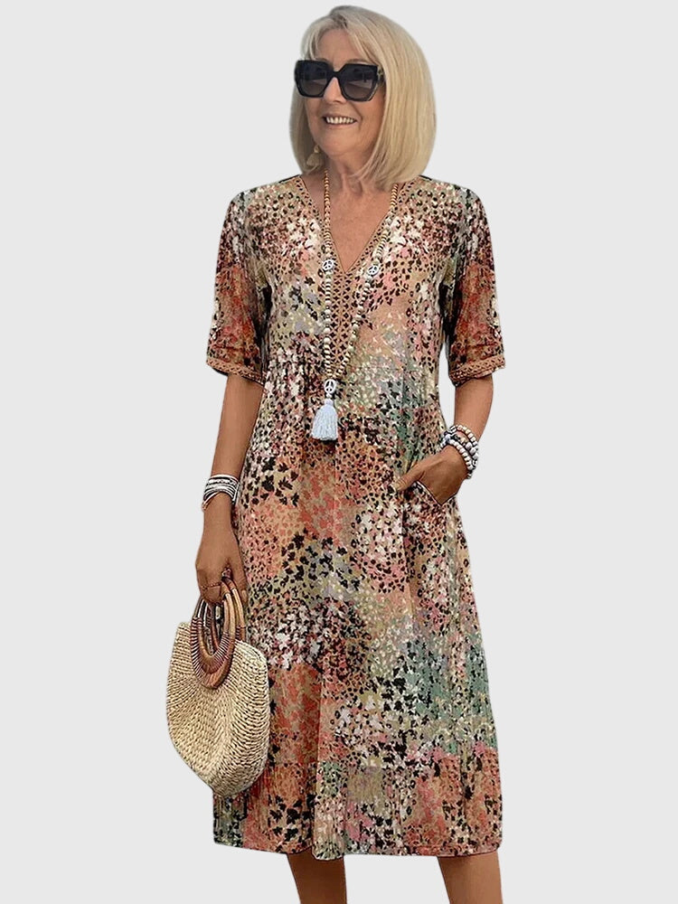 Bequemes Damen Midi-Kleid mit modernem Muster. Perfektes Freizeitkleid mit V-Ausschnitt.