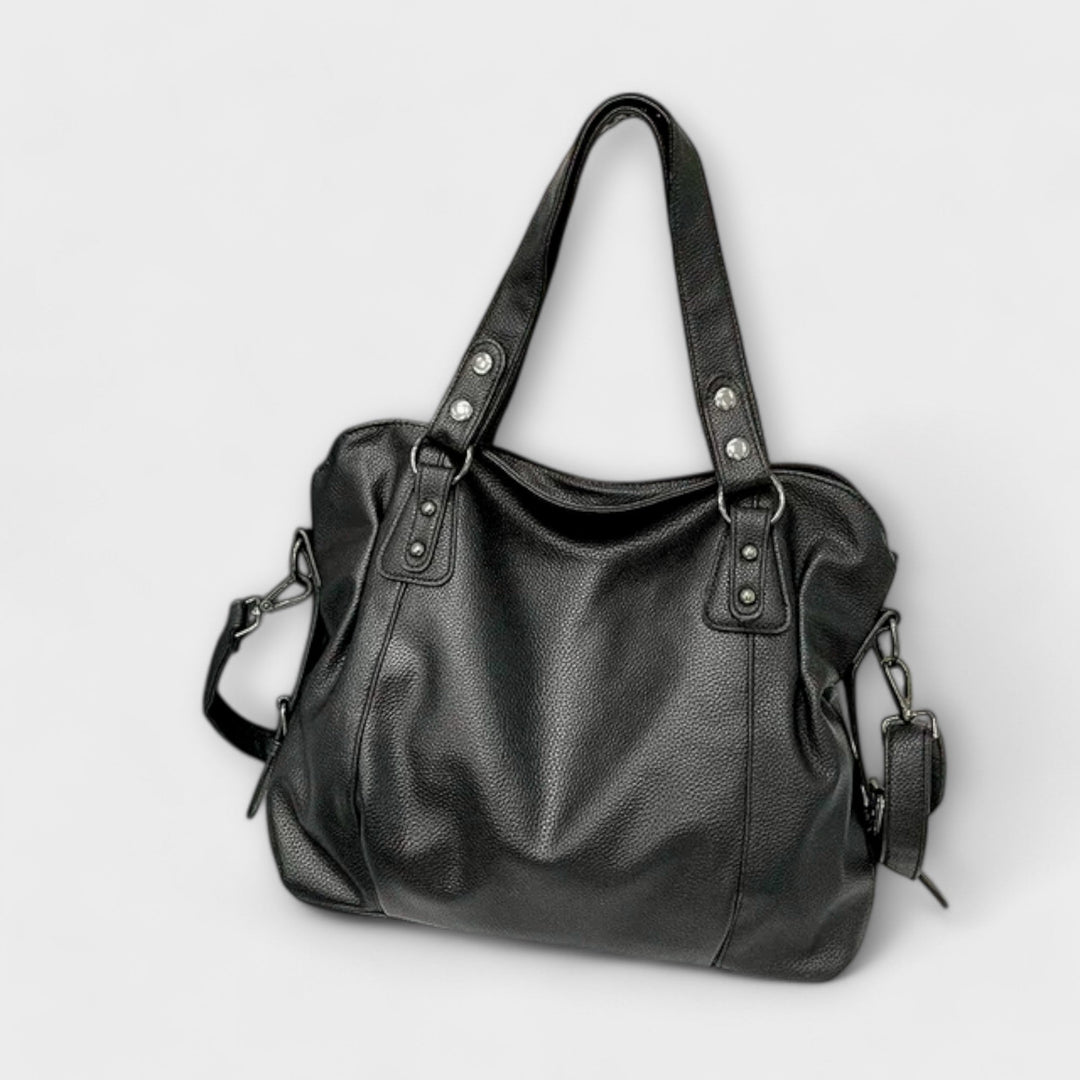 Schwarze zeitlose Hobo-Tasche für Damen aus Kunstleder, perfekt als elegante Alltagstasche oder Handtasche.