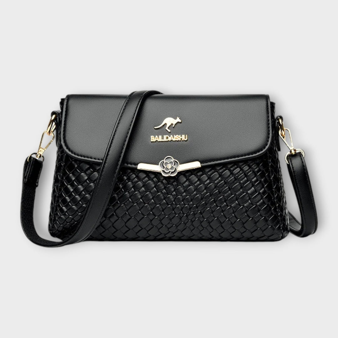 Elegante gewebte Damen Umhängetasche aus Kunstleder, ideal für den stilvollen Alltags-Look. Moderne Crossbody-Tasche.