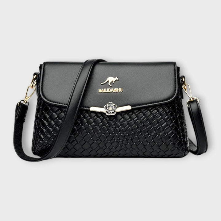Elegante gewebte Damen Umhängetasche aus Kunstleder, ideal für den stilvollen Alltags-Look. Moderne Crossbody-Tasche.