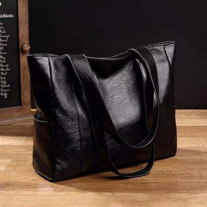 Elegante Damen Vintage Ledertasche für Büro & Alltag. Klassischer Shopper aus schwarzem Leder, ideal für Herbst/Winter.