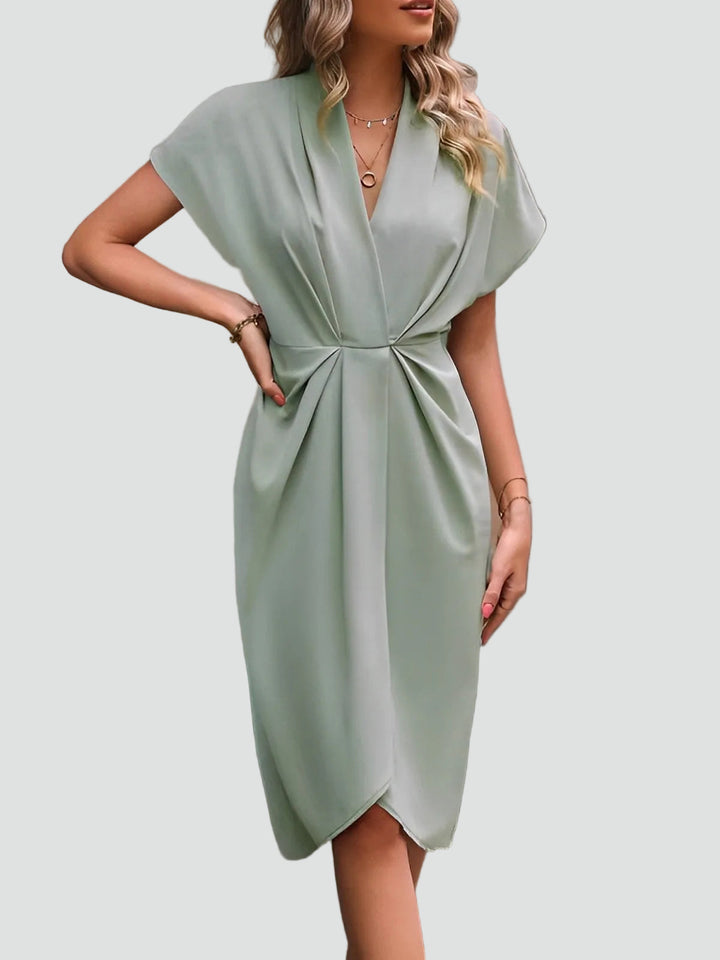 Stilvolles Damenkleid, Wickel-Midi-Schnitt, zeitlos elegant und vielseitig für jede modebewusste Frau.