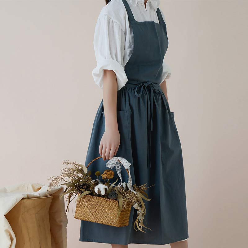 Robuste Baumwoll-Küchenschürze, unisex, mit verstärkten Nähten und praktischen Taschen.