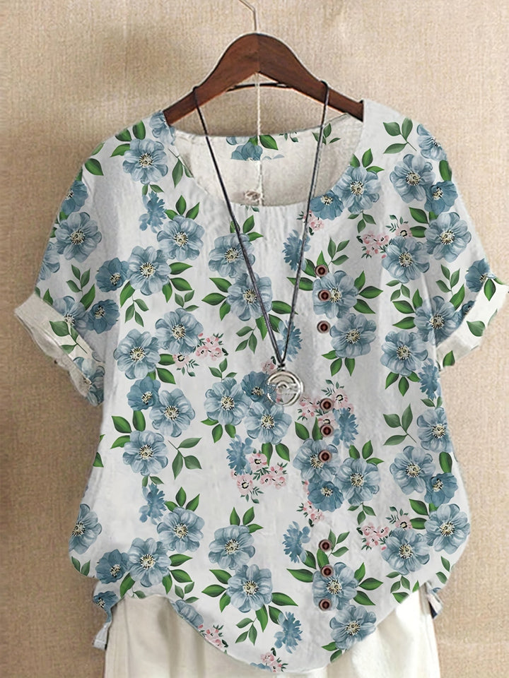 Stilvolle Vintage Damenbluse mit Blumenmuster & Knopfleiste, ideal für elegante Sommer-Freizeitoutfits.