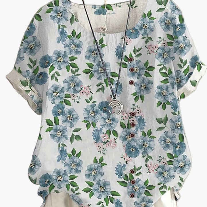 Bequeme Vintage Damenbluse für den Sommer mit lebhaftem Blumenmuster und charmanter Knopfleiste.