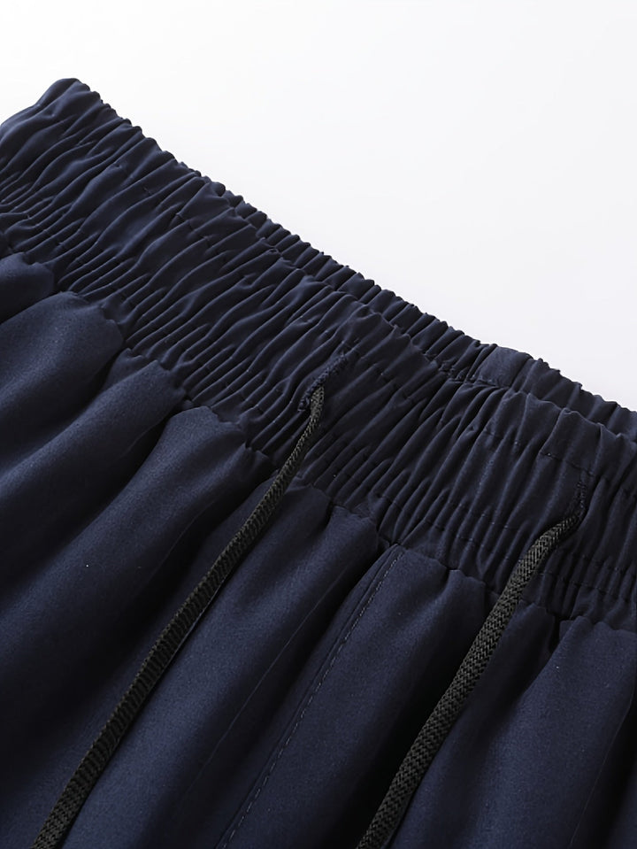 Herren 2-in-1 Laufshorts, Schwarz, mit integrierter Kompressionshose für zusätzlichen Halt und Schutz.