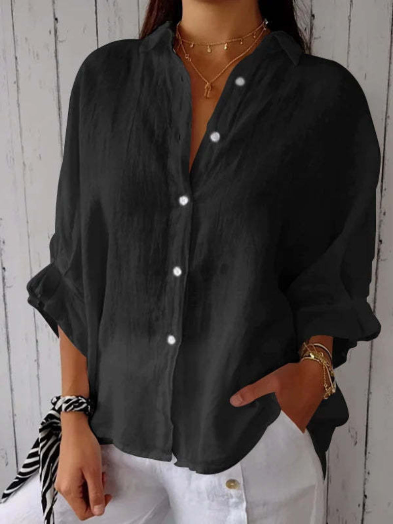 Rückenansicht der eleganten Damen Oversize Bluse von Lois Amsterdam mit großem Schleifen-Detail.