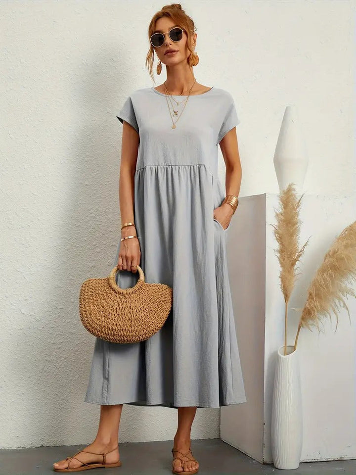 Atmungsaktives Damen Midikleid mit praktischen Taschen; ideal als bequemes Sommerkleid.