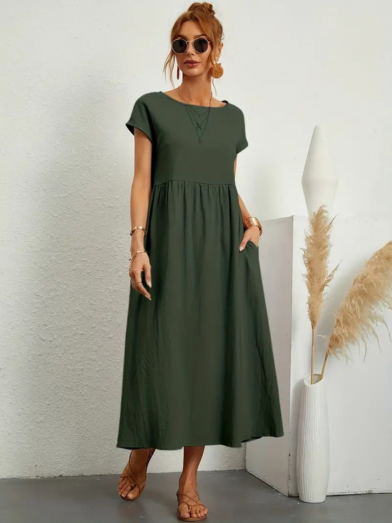 Modernes Damenkleid in Midi-Länge mit praktischen Taschen; stilvolles Frühlings-Outfit.