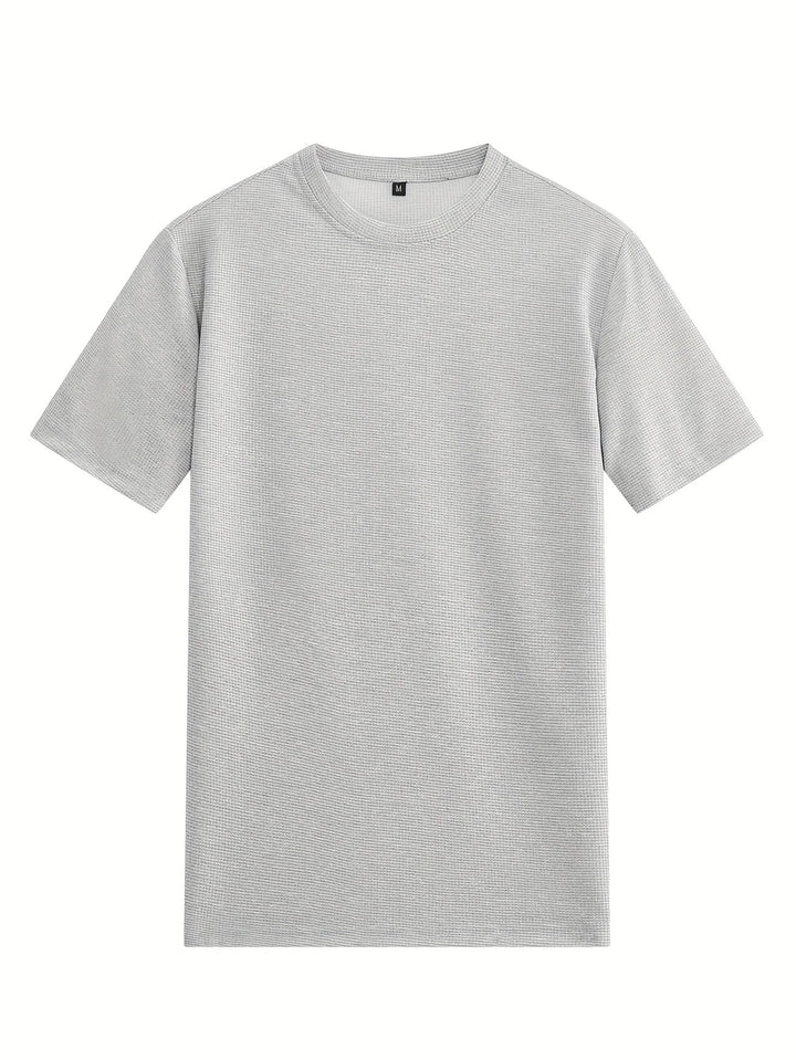 Flexibles Herren Fitness Outfit: Atmungsaktives T-Shirt und Shorts, passend für jede Bewegung.