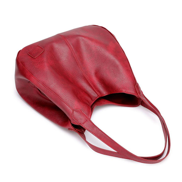 Vielseitige Damen Schultertasche aus PU Leder mit sicheren Reißverschlussfächern.