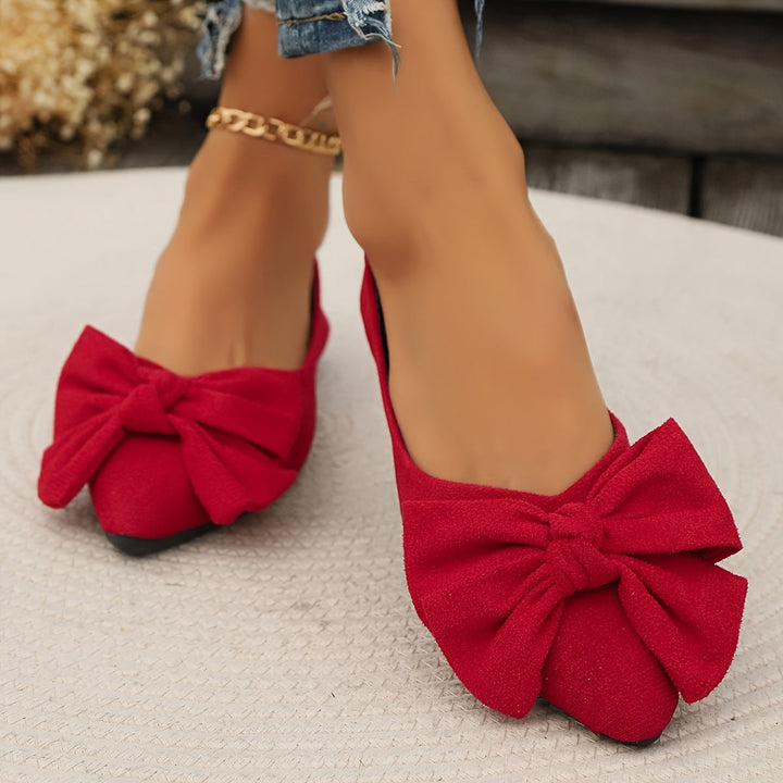 Stylische Damen Ballerinas mit spitzer Zehenpartie und schicker Schleife. Komfortable Freizeitschuhe.