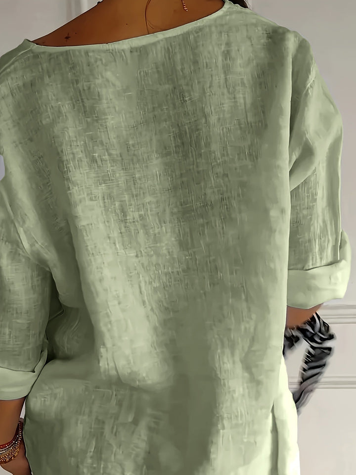 Apricotfarbenes Damen Oberteil mit 3/4-Ärmeln, Knopfleiste; casual Eleganz für jede Gelegenheit.