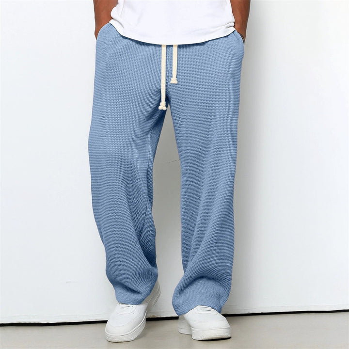 Stilvolle Herren-Freizeithose mit lockerem Schnitt. Bietet Komfort und Stil für Alltag & leichte Sportarten.