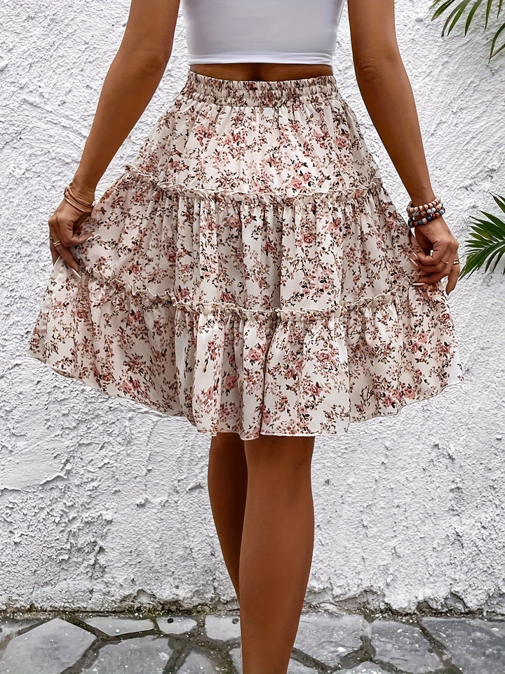 Rosa Damen Midirock im Boho-Stil mit zartem Blumenmuster, fließend und elegant für warme Tage.