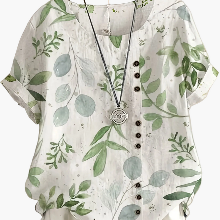 Verspielte Vintage Damenbluse mit floralem Muster, Knopfleiste, ideal für warme Sommertage.