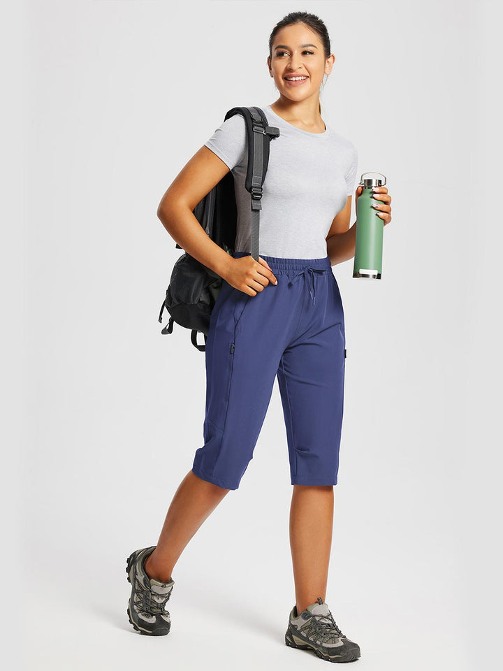 Damen Caprihose für Wanderungen, UPF 50+ Schutz, mit Reißverschlusstaschen.