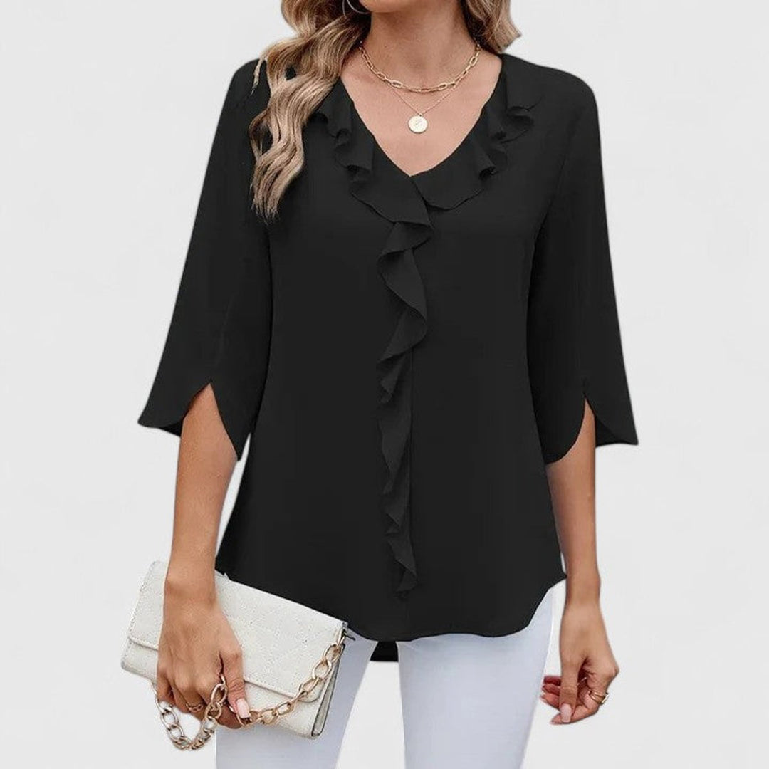 Modische Rüschenbluse für Damen mit V-Ausschnitt und Dreiviertelarm. Ein stilvolles Oberteil für Frühling & Sommer.