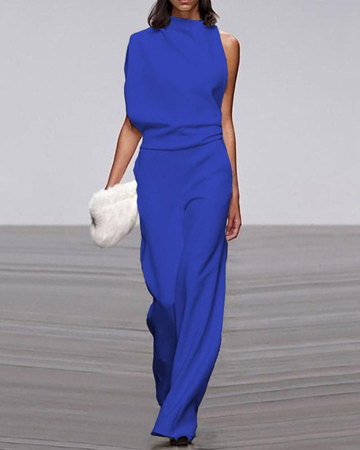 Zeitloser Damen-Jumpsuit mit weitem Bein und One-Shoulder-Detail. Ideal für Hochzeitsgäste & Sommer-Partys.