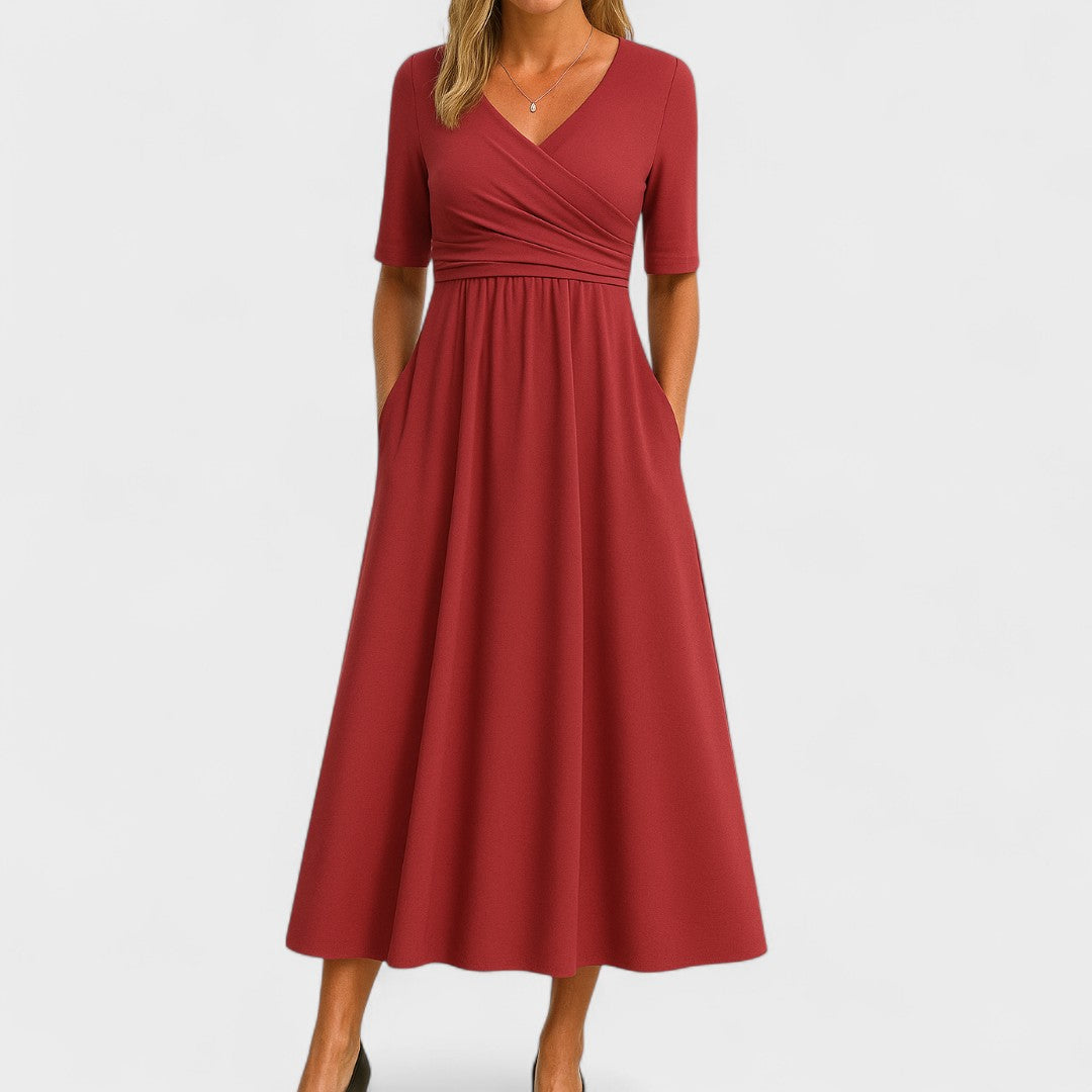 Elegantes Damen Wickel-Midikleid mit fließendem Rockteil, figurschmeichelnde Silhouette von hinten.