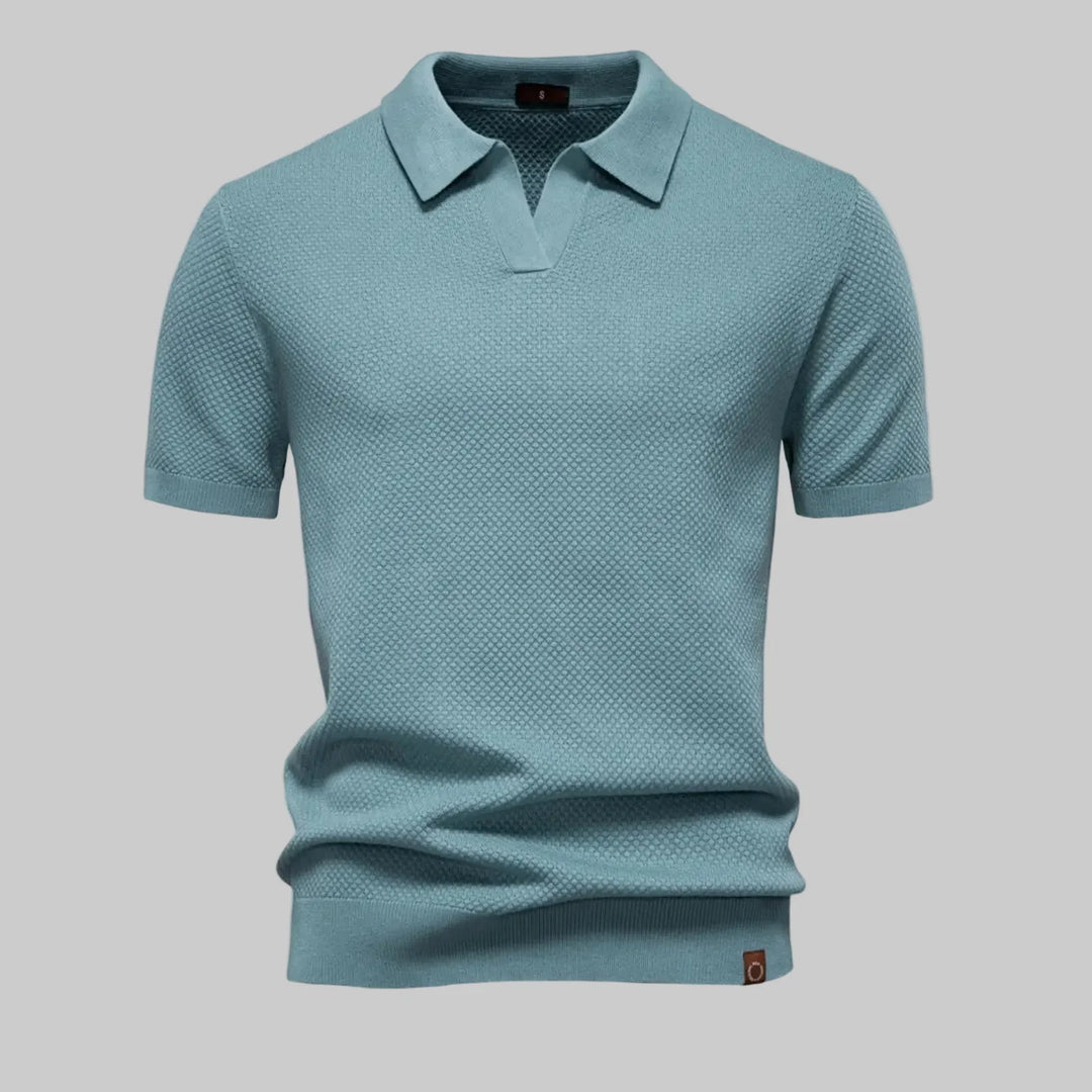 Herren Strukturiertes Poloshirt Elio. Stilvolles Kurzarm-Oberteil für Eleganz & Komfort. Ideal für Sommer & Freizeit.