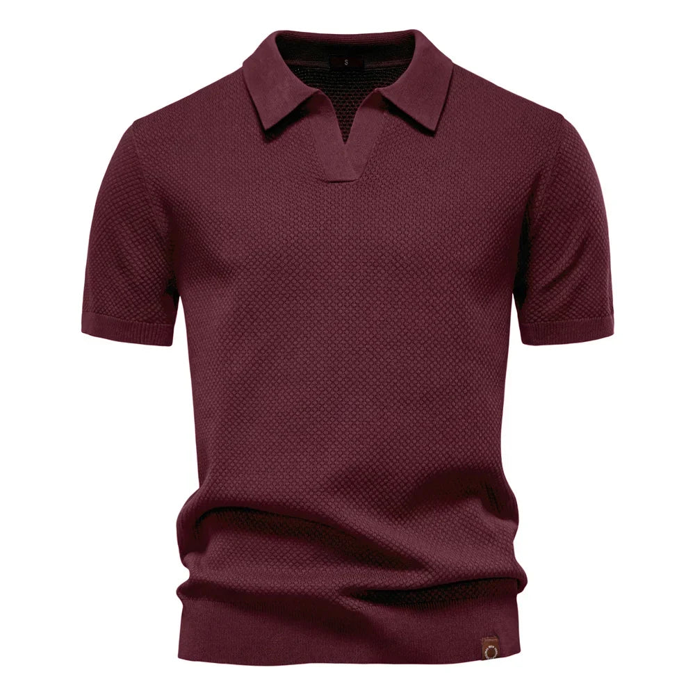 Das Elio Poloshirt für Herren. Strukturiertes Kurzarm-Oberteil kombiniert Stil, Eleganz und Komfort. Sommer bereit.