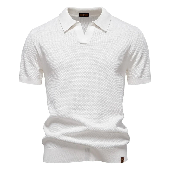 Modernes Herren Poloshirt Elio in neutraler Farbe. Strukturiertes Design, Kurzarm und hoher Tragekomfort.