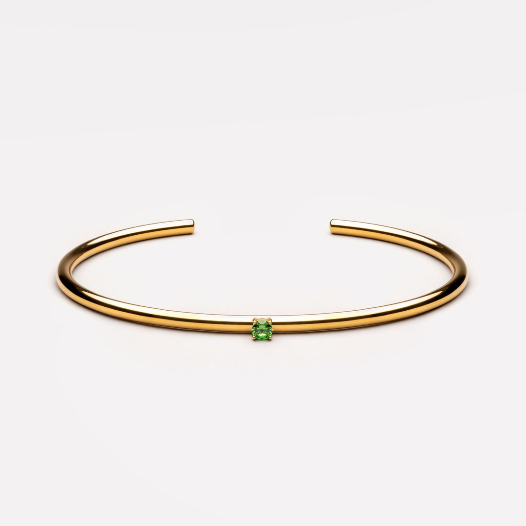 Glänzender Damen Armreif in Gold/Silber, wasserfest und verstellbar, mit einem einzelnen Zirkonstein.