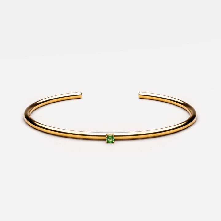 Glänzender Damen Armreif in Gold/Silber, wasserfest und verstellbar, mit einem einzelnen Zirkonstein.