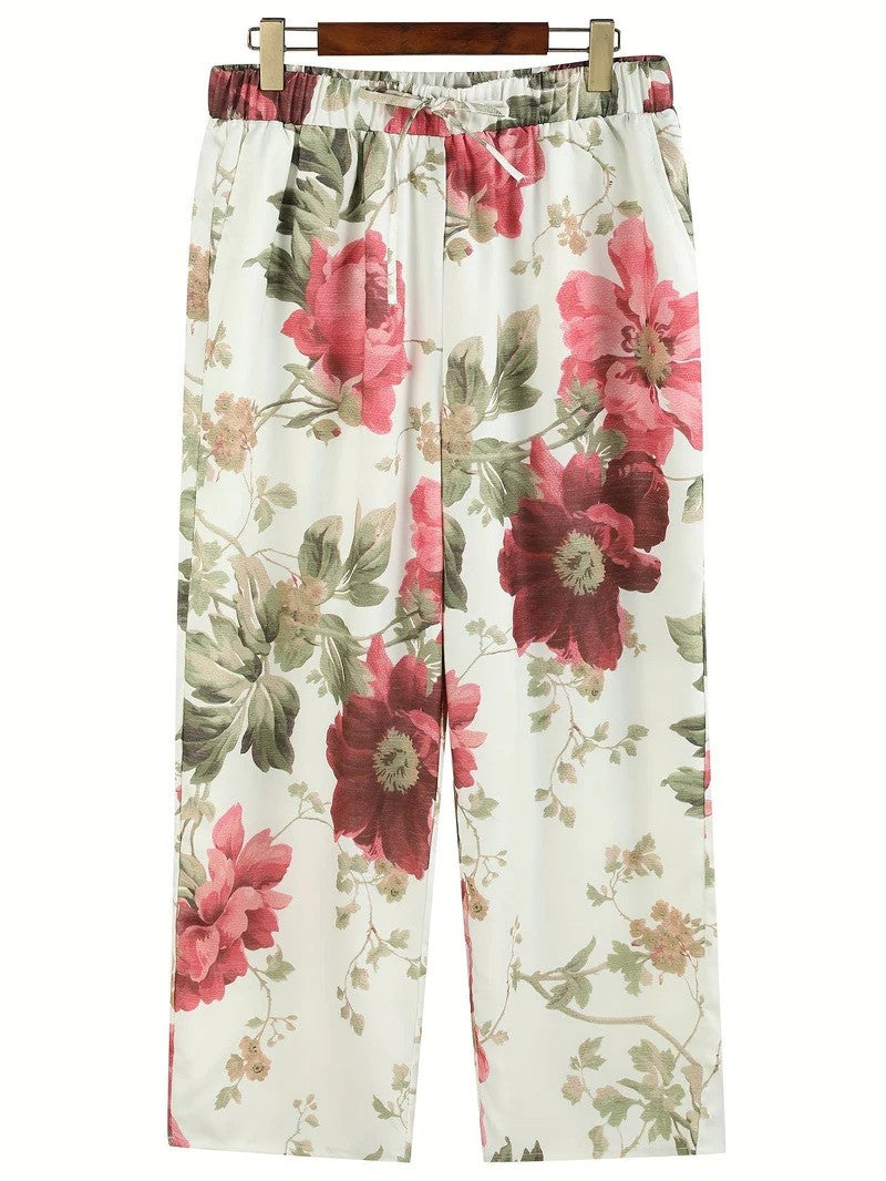 Damenhose mit geblümtem Muster, weitem Bein und komfortablem, elastischem Bund – ideal für Frühlingstage.