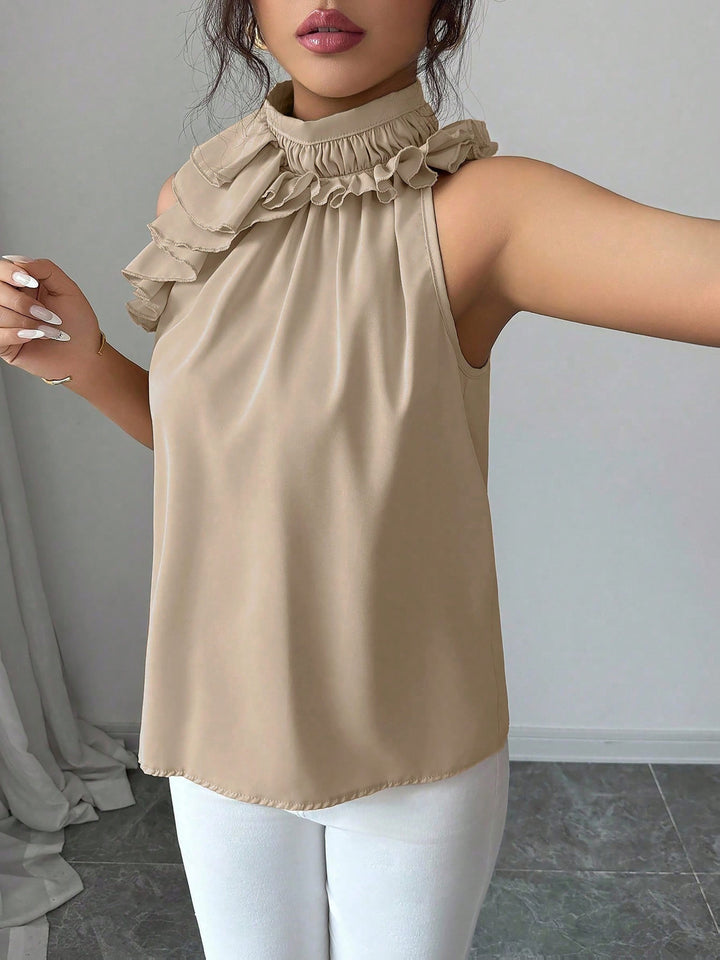 Damen Oberteil mit Stehkragen, Rüschen und ohne Ärmel, ideal für einen eleganten und luftigen Look.