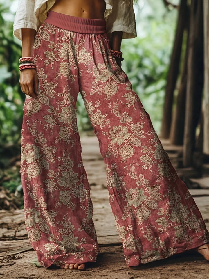 Bequeme Damenhose mit weiten Beinen und Blumenmuster, elastischer Bund, perfekt für Freizeit & Sommer.