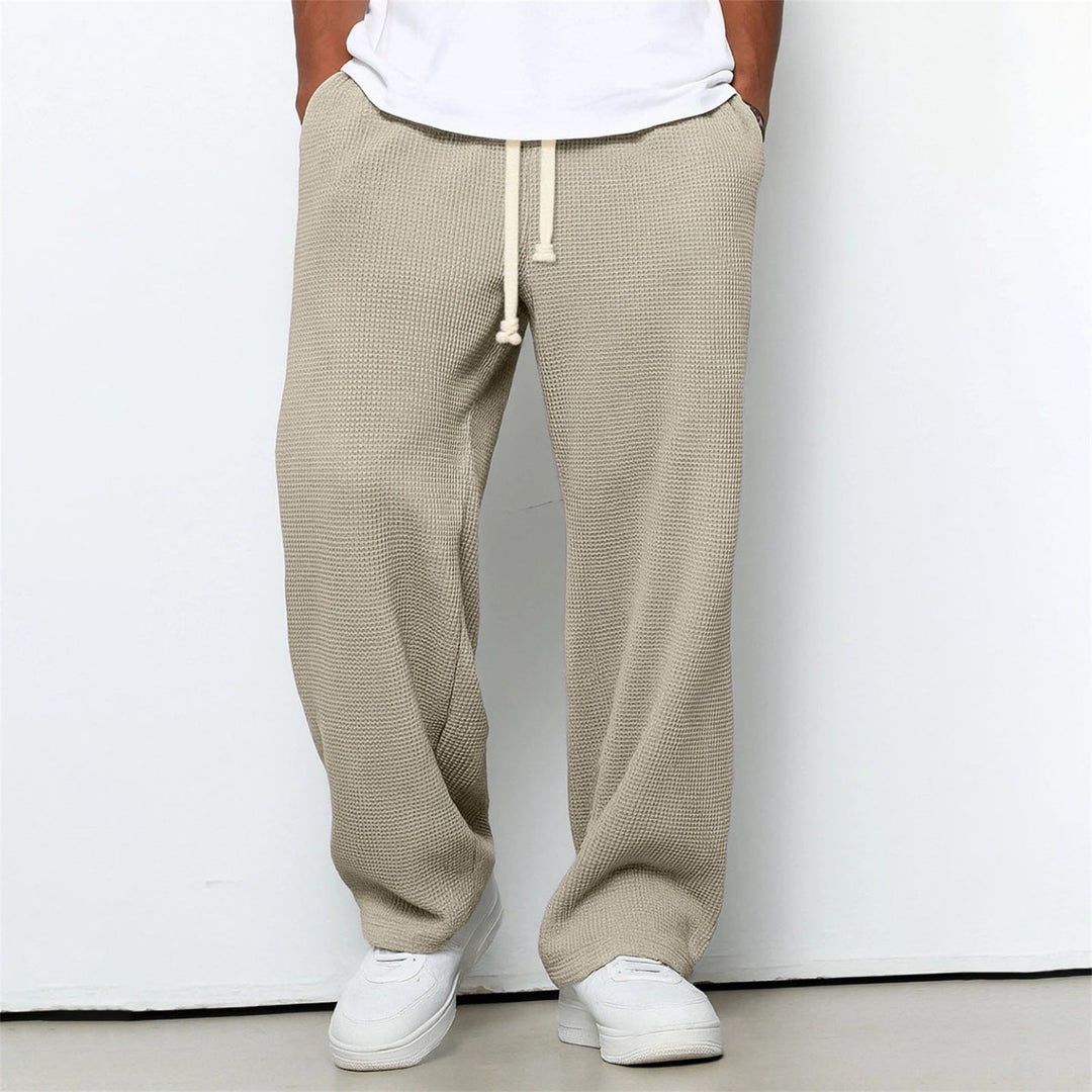 Stilvolle Herrenhose mit geradem Bein und lockerem Schnitt, vielseitig einsetzbar als Freizeithose oder Sporthose.