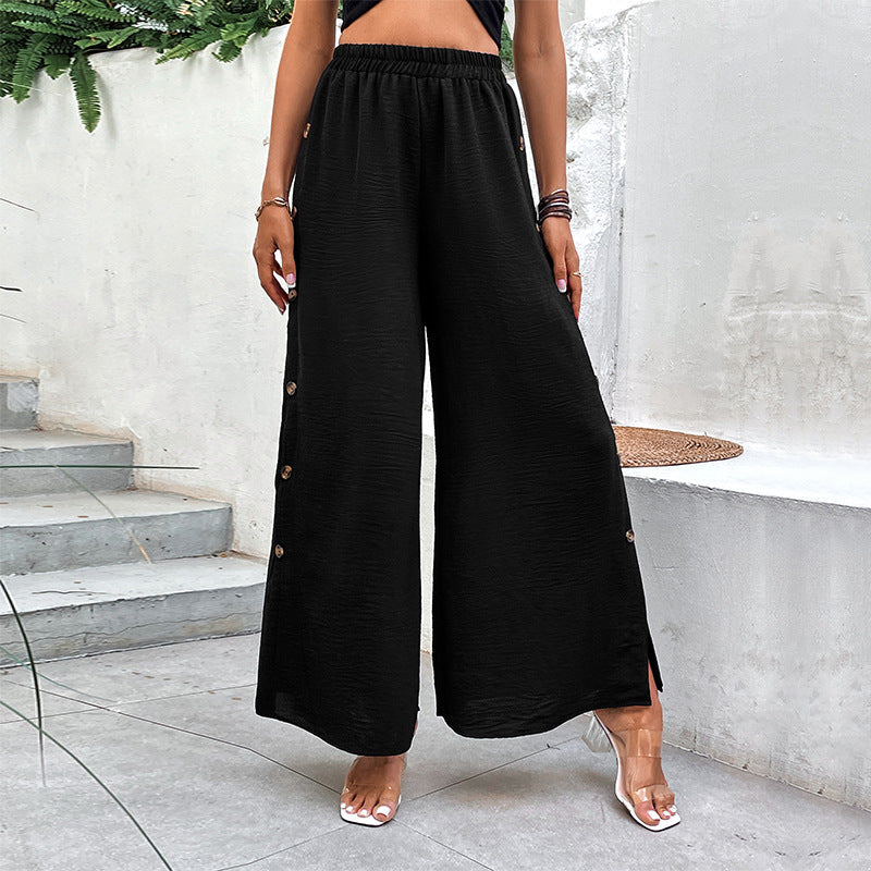 Komfortable schwarze Damenhose mit hohem Bund, weitem Bein und seitlichen Schlitzen für Freizeit.