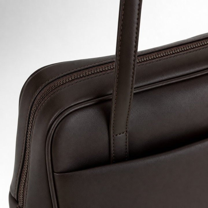 Praktische schwarze Damen Boston-Handtasche aus Kunstleder, vielseitig als Schultertasche für jeden Anlass.
