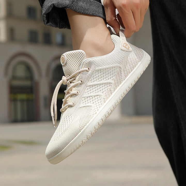 Detail: Atmungsaktives Mesh-Gewebe des Herren Barfußsneakers, ideal für Komfort & Belüftung.