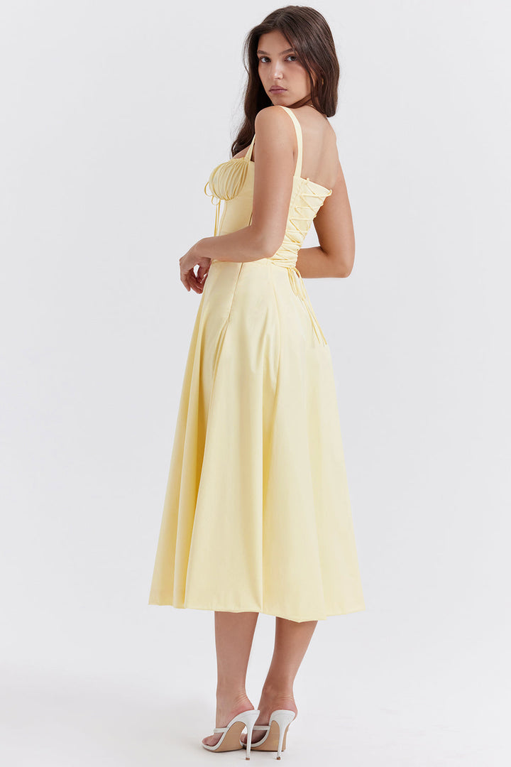 Rückenansicht des eleganten Bustier-Kleides für Damen, mit Blumenmuster und taillierter Silhouette.