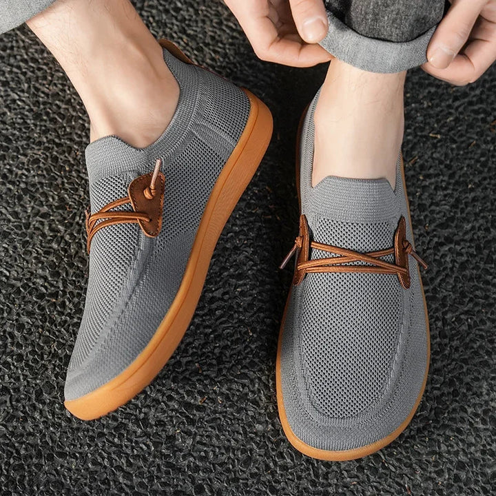 Bequeme schwarze Herren Barfußschuhe, breit und flexibel, ideal für Freizeit und Sport.