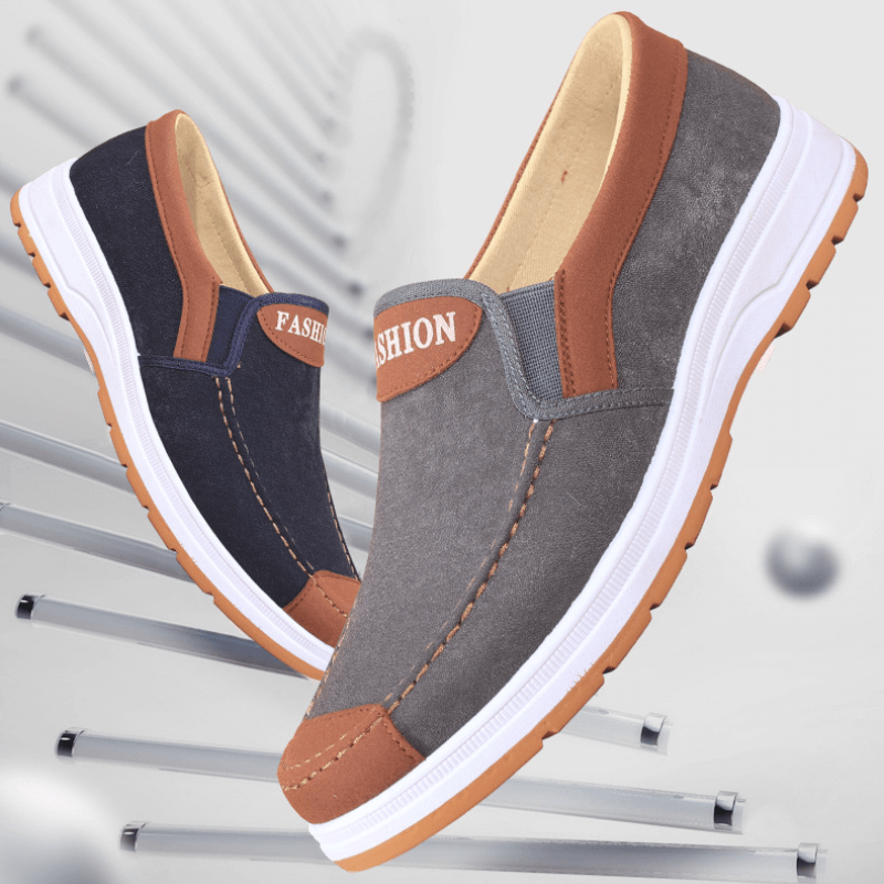Mann trägt Matteo Herren Slip-On Canvas-Schuhe, ideal für mühelosen Komfort und einen lässigen Freizeit-Look.