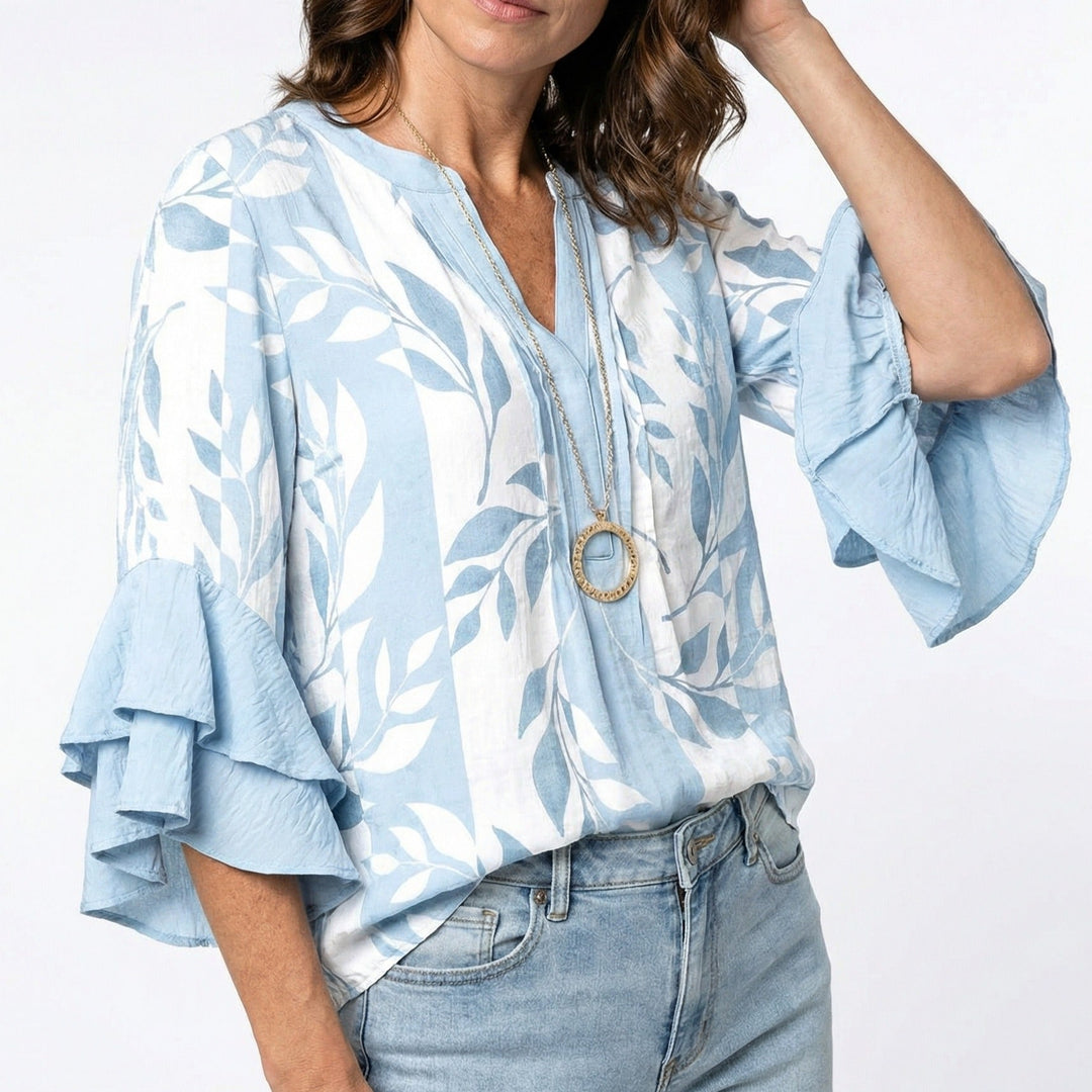 Elegante Damen Bluse mit Blumenmuster und Rüschenärmeln. Ideal für Business Casual & Freizeitmode.