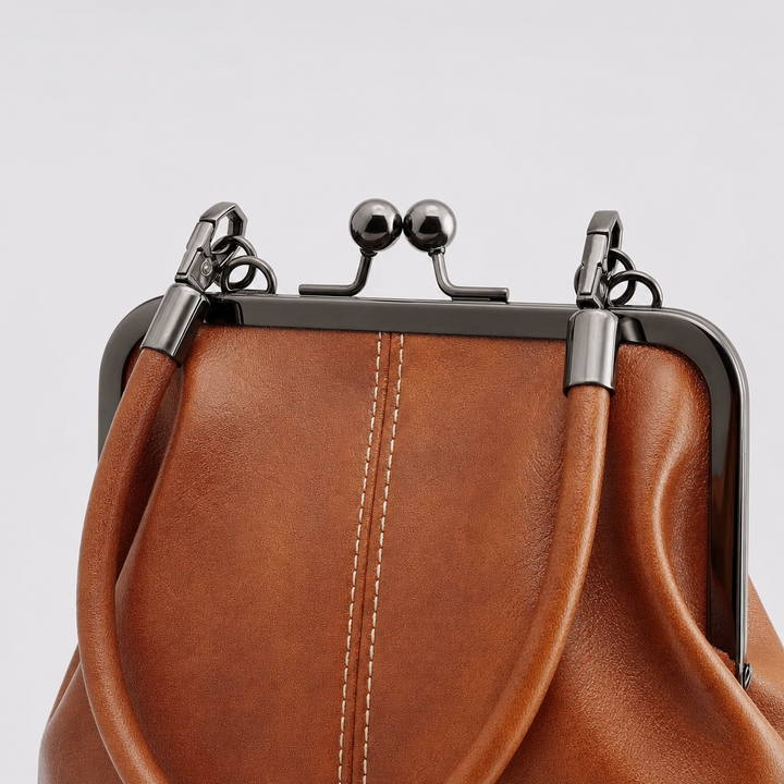 Elegante Damen Bügeltasche in Vintage-Optik, mit Kussverschluss, geräumig und modisch als Accessoire.