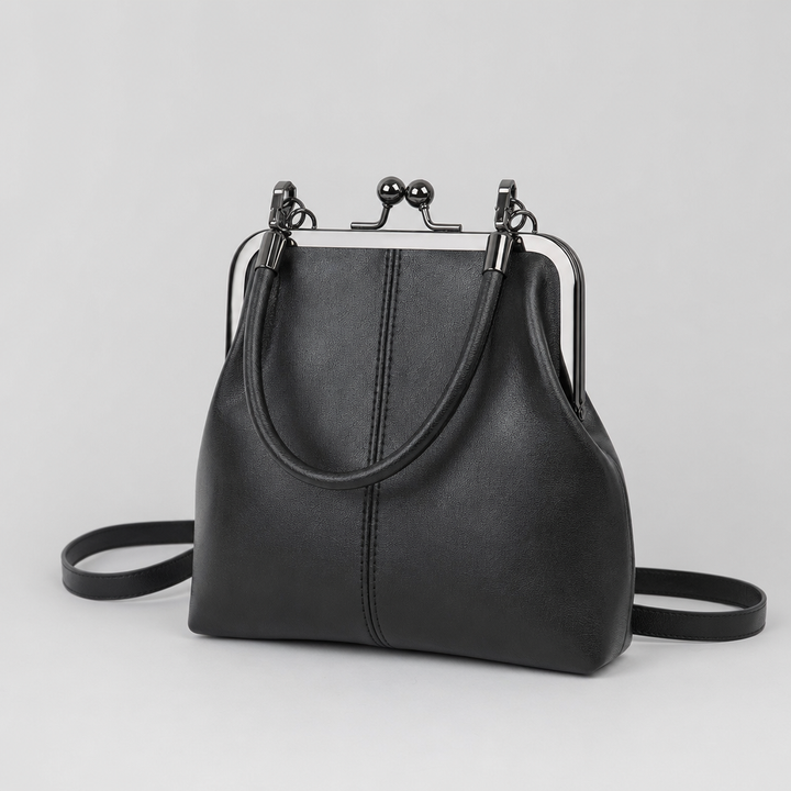 Stilvolle Damen Schultertasche im Vintage-Look, mit charakteristischem Kussverschluss, aus hochwertigem Kunstleder.