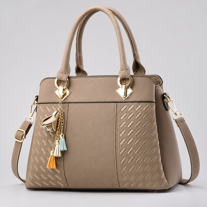 Elegante Damen Henkeltasche in geflochtener Optik aus Kunstleder.